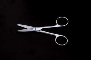large outdoor nail scissors on black background isolated object.