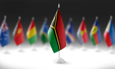 Fototapeta premium The national flag of the Vanuatu on the background of flags of other countries