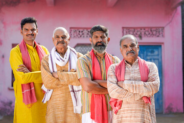 Confident Indian farmers group standing at out of home - obrazy, fototapety, plakaty