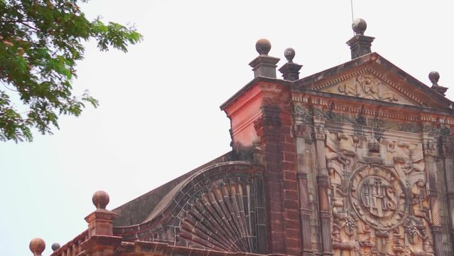 Closeup shot of writings on the top of the Basilica of Bom Jesus monument in Goa, India. Ancient church built by Portuguese at Panaji in North Goa. UNESCO world heritage site of Goa.