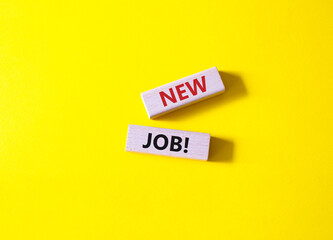 New job symbol. Wooden blocks with words New job. Beautiful yellow background. Business and New job concept. Copy space.