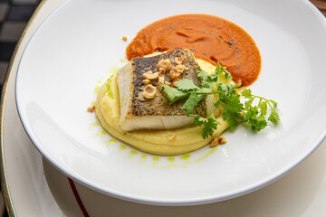 Halibut with mashed potatoes and carrot sauce