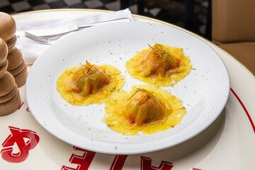 Ravioli with fish in sauce