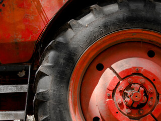 Wheel of an old, retro red tractor