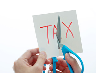 Hand holding scissors cut tax
