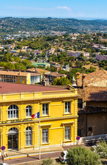 Fototapeta na wymiar Panoramic view of eastern slope of lower city and Coast Cote d'Azur Alps mountains seen from old town quarter of perfumery city of Grasse in France