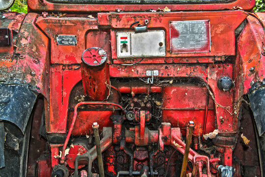 Details of an old, retro red tractor