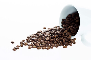 Coffee beans in cup isolated on white background