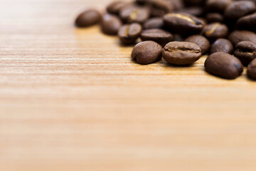 Coffee beans on wooden table
