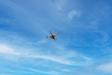 Drone in the sky, small quadrocopter flying, professional video gadget, digital photo equipment