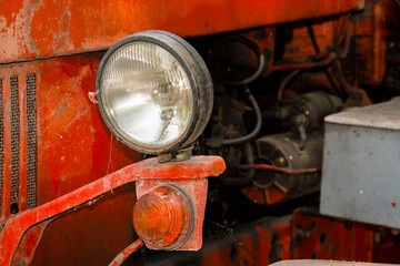 Details of an old, retro red tractor