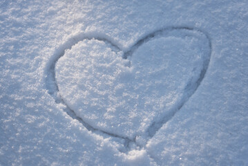 Heart pattern on white snow. Winter background. - 552772659