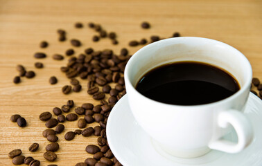 Coffee and beans on wooden table