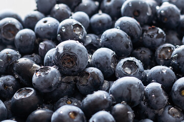 Blueberries floating. Fresh blueberries background with copy space for your text. Vegan and vegetarian concept.Texture blueberry berries close up.