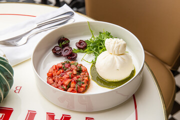 Burrata with strawberries, basil and cherries