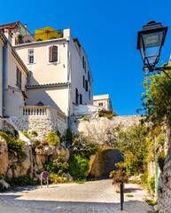Medieval stone defense tower house at Rue Barque en Cannes street in historic old town of Antibes...