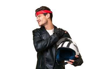 Young caucasian man with a motorcycle helmet over isolated background suffering from pain in shoulder for having made an effort