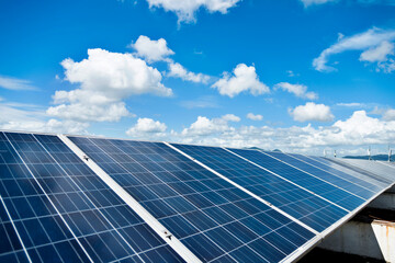 Solar panels against blue sky background