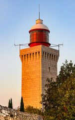 Historic Lighthouse tower on top of Garoupe Hill at Cap d’Antibes cape onshore Azure Cost of...
