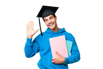Young university graduate man over isolated background saluting with hand with happy expression