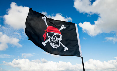 Pirate flag waving on sky
