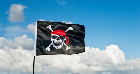 Pirate flag waving on sky