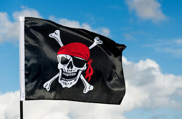Pirate flag waving on sky