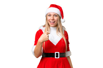 Young blonde woman with christmas hat over isolated chroma key background with surprise facial expression