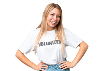 Young volunteer woman over isolated chroma key background posing with arms at hip and smiling