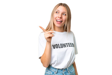 Young volunteer woman over isolated chroma key background intending to realizes the solution while...