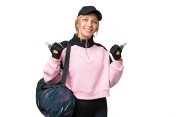 Pretty sport woman with sport bag over isolated chroma key background with thumbs up gesture and smiling