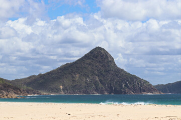 Fototapeta na wymiar View toward Tomaree Mountain in Port Stephens, taken from the Fingal Spit on a sunny blue sky day