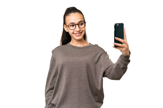 Young Arabian woman over isolated chroma key background making a selfie