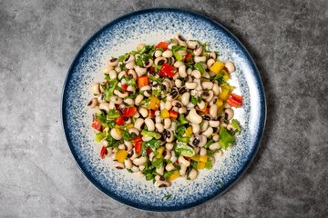 Dried cowpea salad on a dark background. Turkish cuisine appetizer flavors. Top view. close up