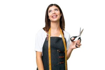 Seamstress woman over isolated chroma key background laughing