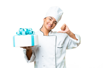 Woman pastry chef with a big cake proud and self-satisfied