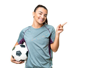 Young football player Woman over isolated chroma key background pointing finger to the side