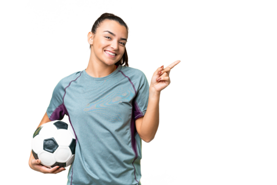 Young football player Woman over isolated chroma key background pointing finger to the side