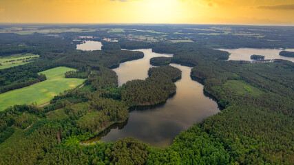 Aerial view of the old town aerial view over green forest with river in the morning. summer...