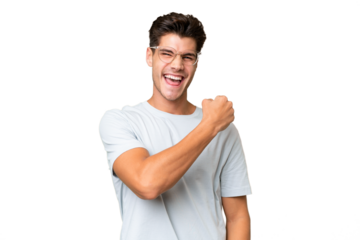 Young caucasian handsome man over isolated background celebrating a victory