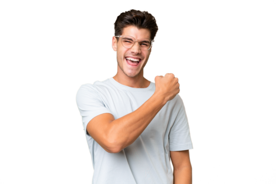 Young caucasian handsome man over isolated background celebrating a victory