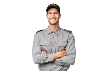 Young security man over isolated background keeping the arms crossed in frontal position