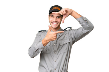 Young security man over isolated background focusing face. Framing symbol
