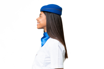 Airplane stewardess African american woman over isolated background laughing in lateral position