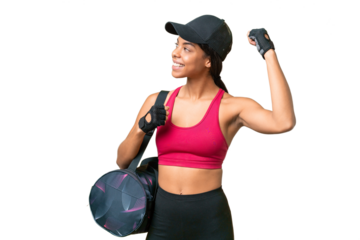 Young sport African american woman with sport bag over isolated background celebrating a victory
