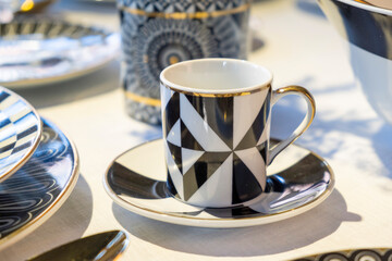 ceramic espresso cup with black and white geometric design