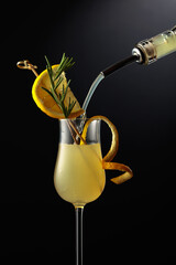 Limoncello is poured into a glass.