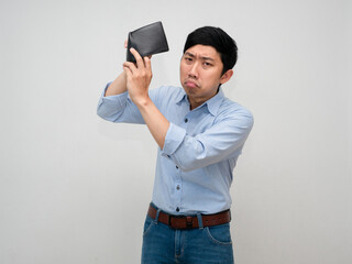 Asian businessman feels sad about no money in his wallet,Poor male employee isolated