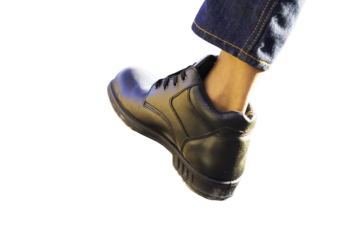 Wear safety shoes to ensure safety at work. construction workers wear safety shoes. concept construction workers work on the stairs. Sacfety shose isolated on white background clipping  paths