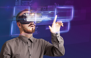 Businessman looking through Virtual Reality glasses, tech concept